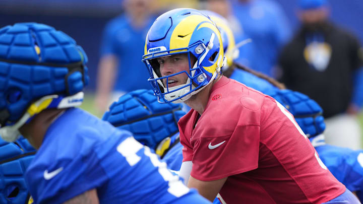 May 28, 2025; Woodland Hills, CA, USA; Los Angeles Rams quarterback Matthew Stafford (9) prepares to take the snap during organized team activities at Rams Practice Facility. Mandatory Credit: Kirby Lee-Imagn Images