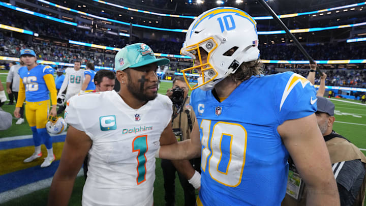 Miami Dolphins quarterback Tua Tagovailoa (1) and Los Angeles Chargers quarterback Justin Herbert (10) shake hands after the game at SoFi Stadium in 2022.
