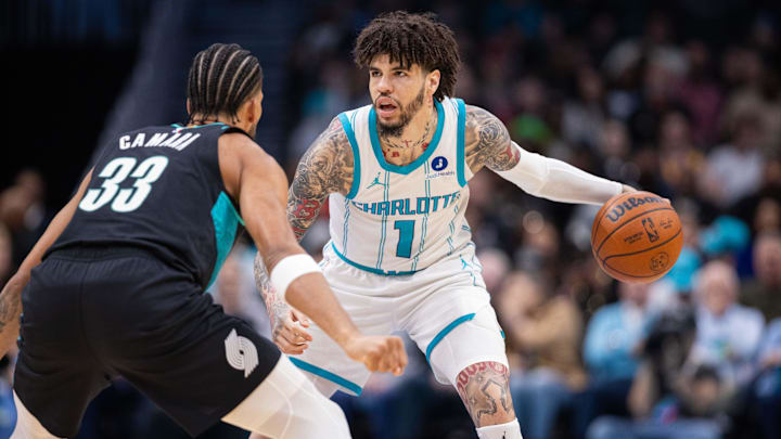 Feb 28, 2026; Charlotte, North Carolina, USA; Charlotte Hornets guard LaMelo Ball (1) brings the ball up court against Portland Trail Blazers forward Toumani Camara (33) during the first quarter at Spectrum Center. Mandatory Credit: Scott Kinser-Imagn Images