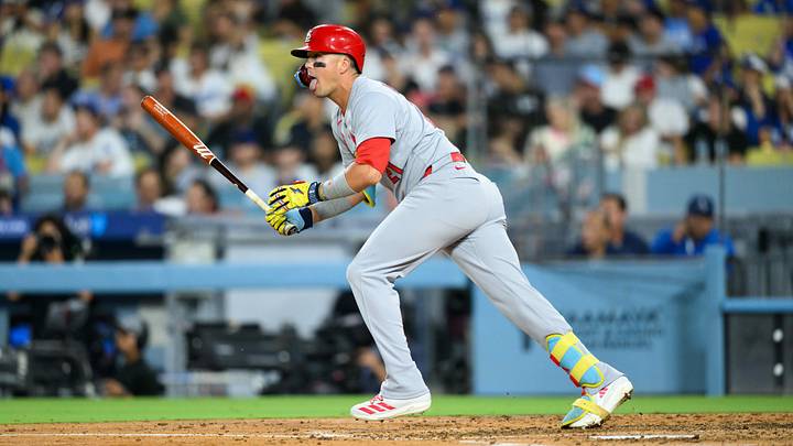 Aug 5, 2025; Los Angeles, California, USA; St. Louis Cardinals center fielder Lars Nootbaar (21) hits a single during the fourth inning against the Los Angeles Dodgers at Dodger Stadium. Mandatory Credit: William Liang-Imagn Images