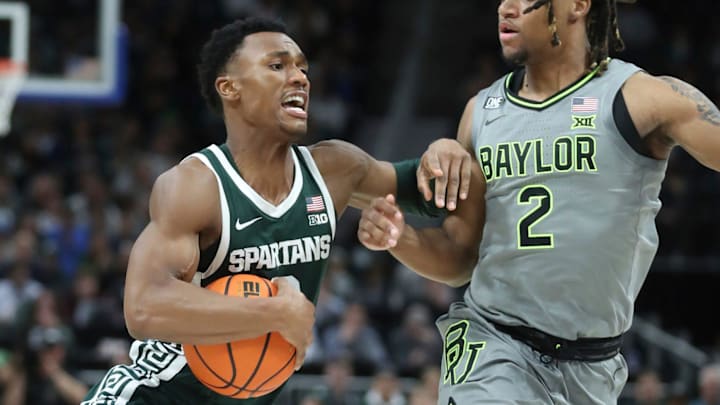 Michigan State guard Tyson Walker drives against Baylor guard Jayden Nunn during the second half of