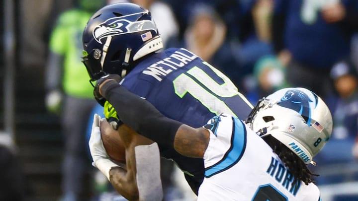Dec 11, 2022; Seattle, Washington, USA; Seattle Seahawks wide receiver DK Metcalf (14) catches a pass against Carolina Panthers cornerback Jaycee Horn (8) during the fourth quarter at Lumen Field. Dec 11, 2022; Seattle, Washington, USA; Seattle Seahawks wide receiver DK Metcalf (14) catches a pass against Carolina Panthers cornerback Jaycee Horn (8) during the fourth quarter at Lumen Field.