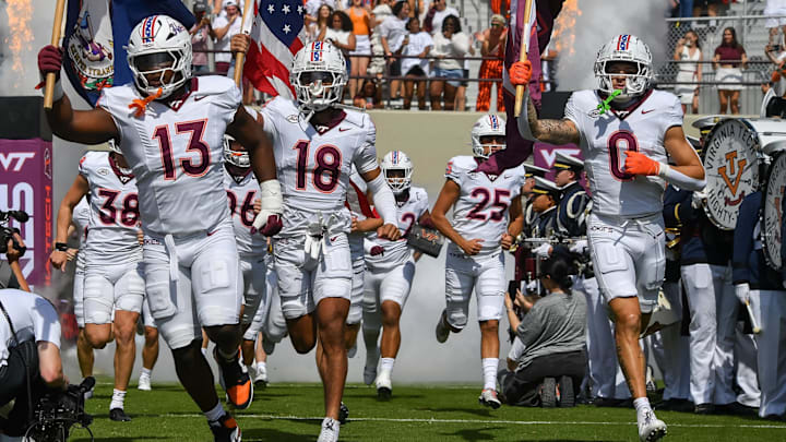 Sep 20, 2025; Blacksburg, Virginia, USA; Virginia Tech Hokies defensive lineman Kemari Copeland (13), quarterback A.J. Brand (18) and wide receiver Ayden Greene (0) run onto the field before the game against The Wofford Terriers at Lane Stadium. Mandatory Credit: Brian Bishop-Imagn Images Sep 20, 2025; Blacksburg, Virginia, USA; Virginia Tech Hokies defensive lineman Kemari Copeland (13), quarterback A.J. Brand (18) and wide receiver Ayden Greene (0) run onto the field before the game against The Wofford Terriers at Lane Stadium. Mandatory Credit: Brian Bishop-Imagn Images