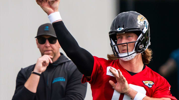 Jacksonville Jaguars quarterback Trevor Lawrence (16) passes as Jacksonville Jaguars head coach Liam Coen watches during the Jacksonville Jaguars’ mandatory minicamp Tuesday June 10, 2025 at the Miller Electric Center in Jacksonville, Fla.