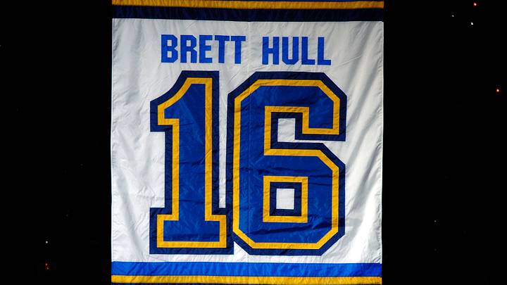 Dec 5, 2006; St. Louis, MO, USA;  Brett Hull and his father Bobby Hull hug in front of Brett's jersey as it starts to rise to the rafters before the Detroit Red Wings and the St. Louis Blues game at the Scottrade Center in St. Louis, MO. Mandatory Credit:Scott Rovak-USA TODAY Sports Copyright © Scott Rovak