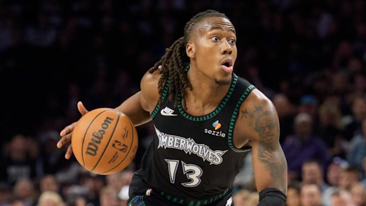 Apr 25, 2026; Minneapolis, Minnesota, USA; Minnesota Timberwolves guard Ayo Dosunmu (13) looks to drive to the basket against the Denver Nuggets in the second quarter at Target Center. Mandatory Credit: Matt Blewett-Imagn Images