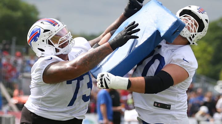 Bills offensive lineman Dion Dawkins collides with Alec Anderson during position drills during day three of Buffalo Bills training camp at St. John Fisher University Friday, July 25, 2025 in Pittsford, NY.