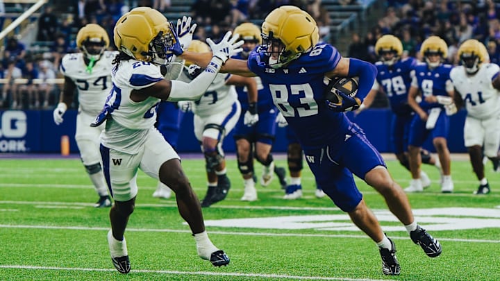 Luke Gayton stiff arms Rahshawn Clark in the UW Spring Game. Luke Gayton stiff arms Rahshawn Clark in the UW Spring Game.