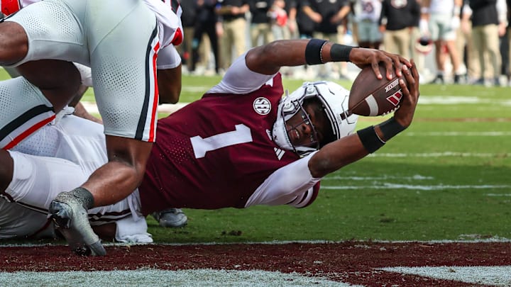 Mississippi State Bulldogs quarterback Kamario Taylor (1) runs for a touchdown against the Georgia Bulldogs during the first half at Davis Wade Stadium at Scott Field.