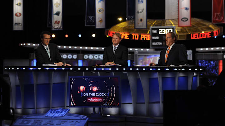 Apr 28, 2011; New York, NY, USA; ESPN analyst Mel Kiper Jr analyst Jon Gruden  and host Chris Berman
