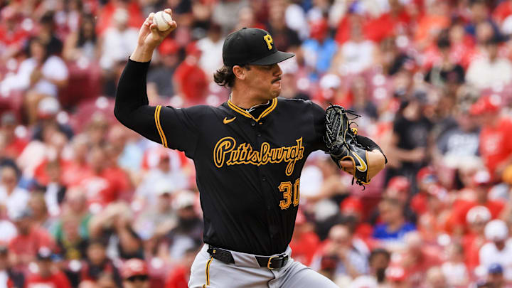 Sep 22, 2024; Cincinnati, Ohio, USA; Pittsburgh Pirates starting pitcher Paul Skenes (30) pitches against the Cincinnati Reds in the first inning at Great American Ball Park. Mandatory Credit: Katie Stratman-Imagn Images