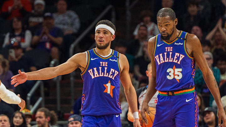 Dec 15, 2024; Phoenix, Arizona, USA; Phoenix Suns guard Devin Booker (1) and forward Kevin Durant (35) react after a time out in the second half during a game against the Portland Trail Blazers at Footprint Center. Mandatory Credit: Allan Henry-Imagn Images Dec 15, 2024; Phoenix, Arizona, USA; Phoenix Suns guard Devin Booker (1) and forward Kevin Durant (35) react after a time out in the second half during a game against the Portland Trail Blazers at Footprint Center. Mandatory Credit: Allan Henry-Imagn Images