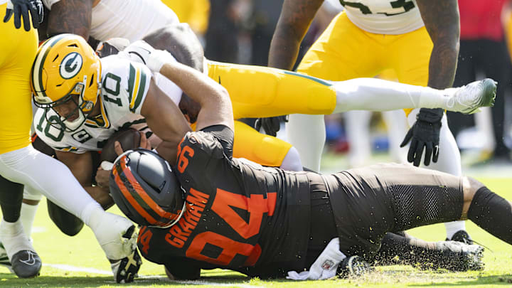 Green Bay Packers quarterback Jordan Love (10) is sacked by Cleveland Browns defensive tackle Mason Graham.