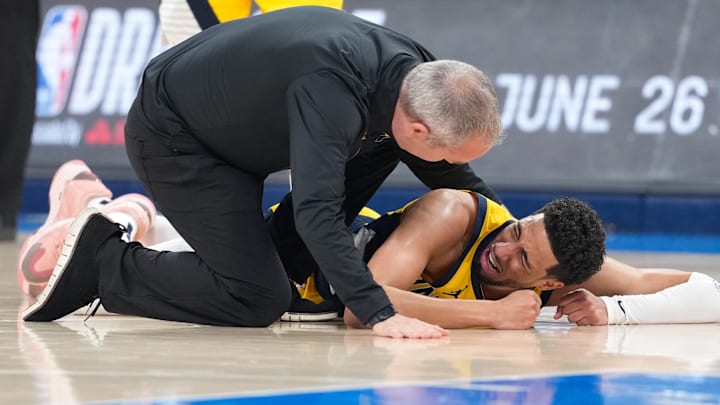 Indiana Pacers guard Tyrese Haliburton (0) reacts after suffering an injury during the first quarter against the Oklahoma City Thunder during game seven of the 2025 NBA Finals at Paycom Center.