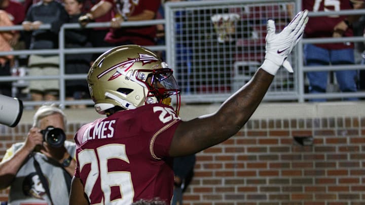 Nov 18, 2023; Tallahassee, Florida, USA;  Florida State Seminoles running back Caziah Holmes (26) celebrates a touchdown against the North Alabama Lions during the third quarter at Doak S. Campbell Stadium. Mandatory Credit: Morgan Tencza-Imagn Images