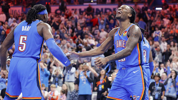 Apr 8, 2025; Oklahoma City, Oklahoma, USA; Oklahoma City Thunder guard Cason Wallace (22) celebrates with Oklahoma City Thunder guard Luguentz Dort (5) after scoring against the Los Angeles Lakers during the second half at Paycom Center. Mandatory Credit: Alonzo Adams-Imagn Images