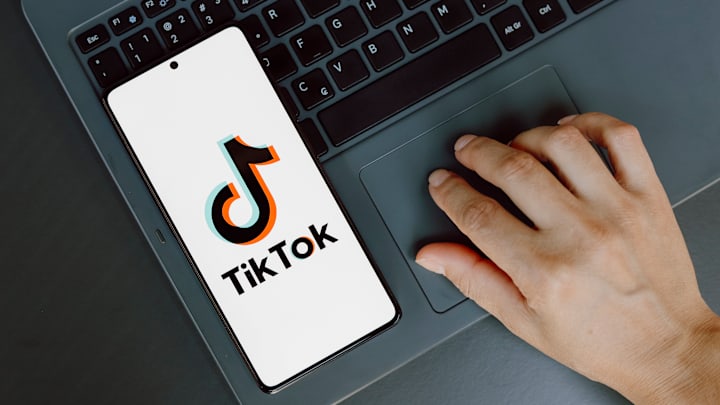 In this photo illustration, the TikTok logo is displayed on...