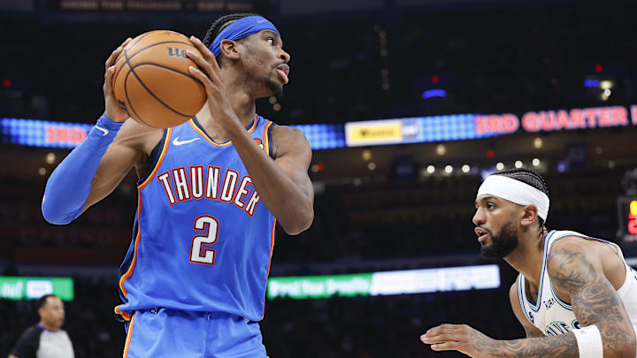 Jan 29, 2024; Oklahoma City, Oklahoma, USA; Oklahoma City Thunder guard Shai Gilgeous-Alexander (2) moves to the basket against Minnesota Timberwolves guard Nickeil Alexander-Walker (9) during the second half at Paycom Center.