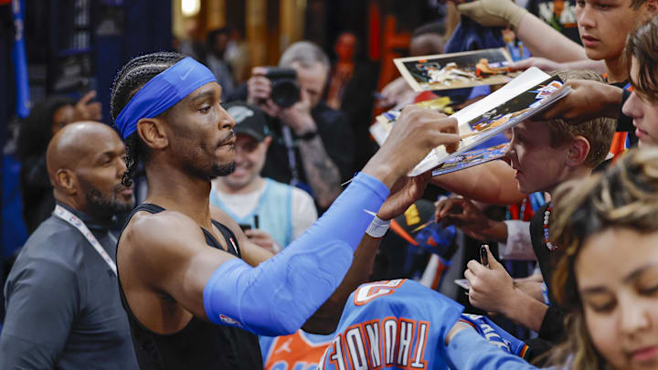 Apr 2, 2025; Oklahoma City, Oklahoma, USA; Oklahoma City Thunder guard Shai Gilgeous-Alexander interacts with fans before the start of a game against the Detroit Pistons at Paycom Center. Mandatory Credit: Alonzo Adams-Imagn Images