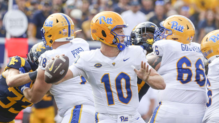 Sep 13, 2025; Morgantown, West Virginia, USA; Pittsburgh Panthers quarterback Eli Holstein (10) throws a pass during the second quarter against the West Virginia Mountaineers at Milan Puskar Stadium. Mandatory Credit: Ben Queen-Imagn Images