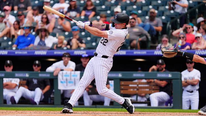 Jul 2, 2026; Denver, Colorado, USA; Colorado Rockies designated hitter Mickey Moniak (22) RBI singles in the sixth inning against the Miami Marlins at Coors Field. Mandatory Credit: Ron Chenoy-Imagn Images Jul 2, 2026; Denver, Colorado, USA; Colorado Rockies designated hitter Mickey Moniak (22) RBI singles in the sixth inning against the Miami Marlins at Coors Field. Mandatory Credit: Ron Chenoy-Imagn Images