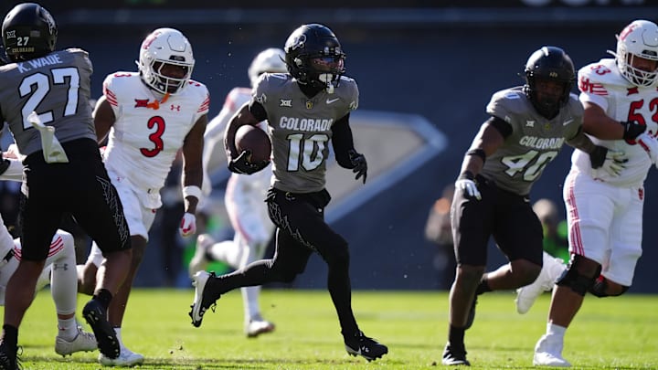 Nov 16, 2024; Boulder, Colorado, USA; Colorado Buffaloes wide receiver LaJohntay Wester (10) returns a punt for a touchdown in the first quarter against the Utah Utes at Folsom Field. Mandatory Credit: Ron Chenoy-Imagn Images