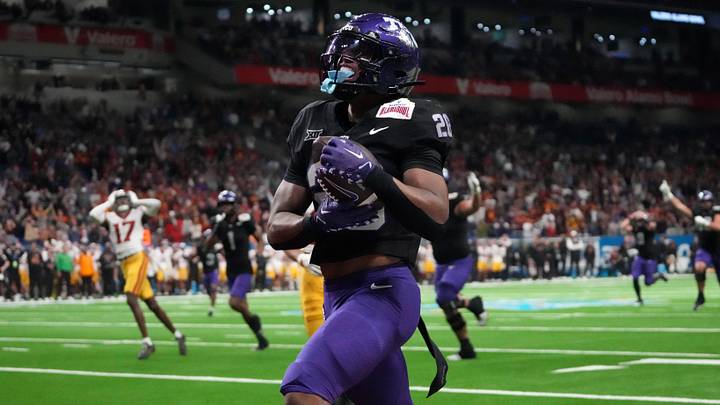 Dec 30, 2025; San Antonio, TX, USA; TCU Horned Frogs running back Jeremy Payne (26) scores on a 35-yard touchdown reception in overtime for the winning score against the Southern California Trojans during the Alamo Bowl at Alamodome. Mandatory Credit: Kirby Lee-Imagn Images