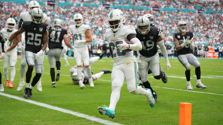 Miami Dolphins running back De'Von Achane (28) scores a touchdown in the fourth quarter against the Las Vegas Raiders at Hard Rock Stadium. Miami Dolphins running back De'Von Achane (28) scores a touchdown in the fourth quarter against the Las Vegas Raiders at Hard Rock Stadium.