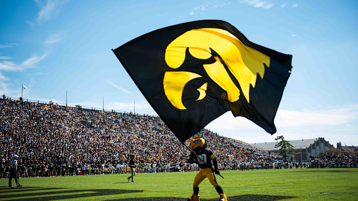 Sep 27, 2014; West Lafayette, IN, USA; The Iowa Hawkeyes mascot waves the Iowa flag in the end zone after a touchdown against the Purdue Boilermakers during the second half of the game at Ross Ade Stadium . The Iowa Hawkeyes beat the Purdue Boilermakers 24 to 10. Mandatory Credit: Marc Lebryk-Imagn Images