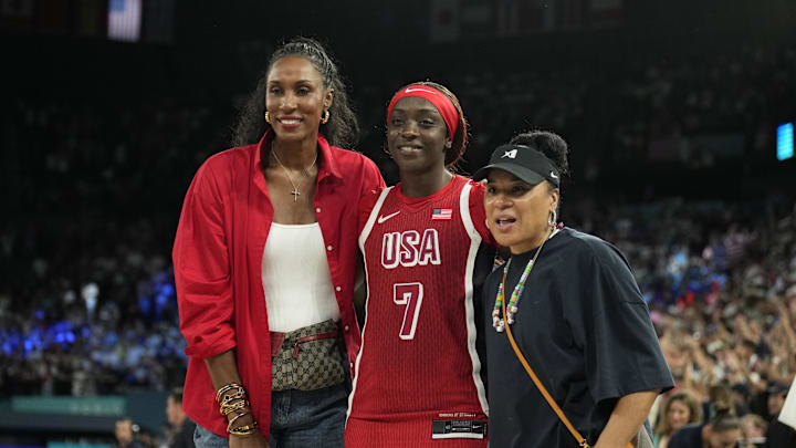 Aug 11, 2024; Paris, France; United States forward Kahleah Copper (7) poses with Lisa Leslie and Dawn Staley after defeating France in the women's gold medal game during the Paris 2024 Olympic Summer Games at Accor Arena. Mandatory Credit: Kyle Terada-Imagn Images
