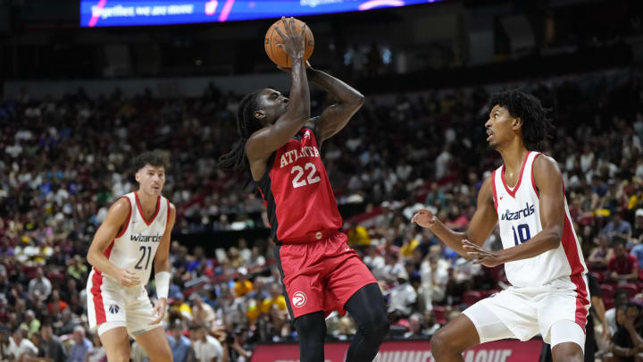 Jul 12, 2024; Las Vegas, NV, USA;  Atlanta Hawks guard Keaton Wallace (22) shoots the ball against Washington Wizards forward John Butler Jr. (19) during the first half at Thomas & Mack Center. Mandatory Credit: Lucas Peltier-USA TODAY Sports