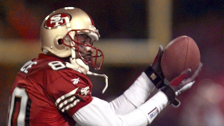 San Francisco wide receiver Jerry Rice makes a catch during pregame warmups on Dec. 15, 1997. Rice is making a comeback after tearing two ligaments in his knee in the first game of the season. San Francisco wide receiver Jerry Rice makes a catch during pregame warmups on Dec. 15, 1997. Rice is making a comeback after tearing two ligaments in his knee in the first game of the season.
