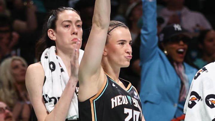 Sep 9, 2025; Brooklyn, New York, USA;  New York Liberty forward Breanna Stewart (30) and guard Sabrina Ionescu (20) celebrate from the bench in the fourth quarter against the Washington Mystics at Barclays Center. Mandatory Credit: Wendell Cruz-Imagn Images