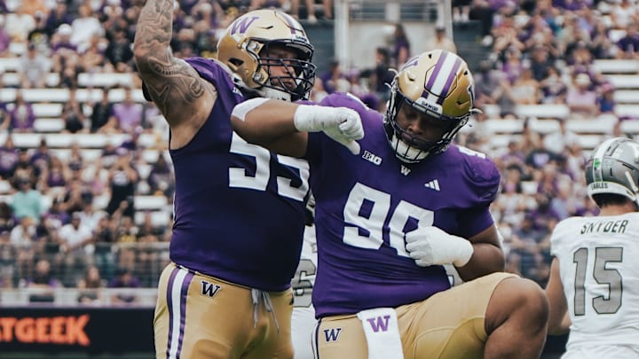Jacob Bandes (55) and Elinneus Davis (90) celebrate Davis' first career sack. Jacob Bandes (55) and Elinneus Davis (90) celebrate Davis' first career sack.