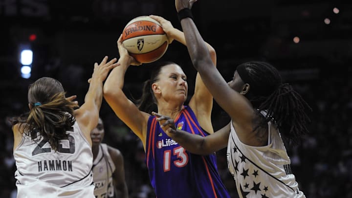August 28, 2010; San Antonio, TX, USA; Phoenix Mercury forward Penny Taylor (13) controls the ball under pressure from San Antonio Silver Stars guards Becky Hammon (25) and Roneeka Hodges (right) during the second half at the AT&T Center. Phoenix beat San Antonio 92-73. Mandatory Credit: Brendan Maloney-Imagn Images