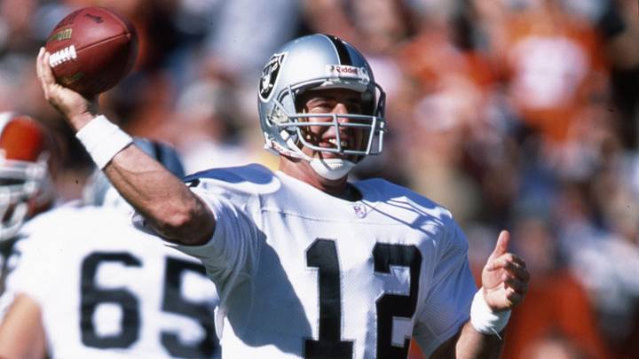 Oct 12, 2003; Cleveland, OH, USA; Oakland Raiders quarterback Rich Gannon (12) throws in the pocket against the Cleveland Browns at Cleveland Browns Stadium. The Browns beat the Raiders 13-7.  Mandatory Credit: Matthew Emmons-Imagn Images