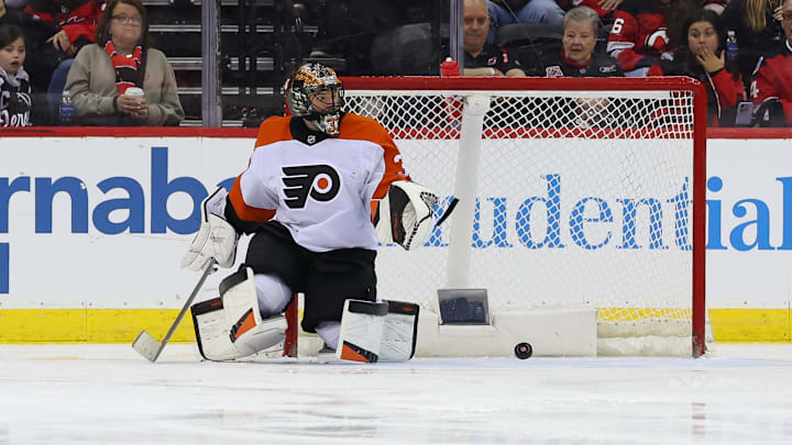 Jan 18, 2025; Newark, New Jersey, USA; Philadelphia Flyers goaltender Samuel Ersson (33) makes a save against the New Jersey Devils during the third period at Prudential Center. Mandatory Credit: Ed Mulholland-Imagn Images