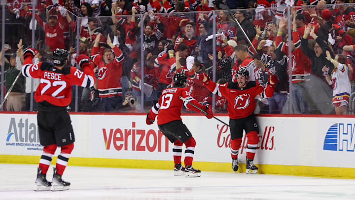 Apr 25, 2025; Newark, New Jersey, USA; New Jersey Devils defenseman Simon Nemec (17) celebrates his game winning goal against the Carolina Hurricanes during the second overtime in game three of the first round of the 2025 Stanley Cup Playoffs at Prudential Center. Mandatory Credit: Ed Mulholland-Imagn Images