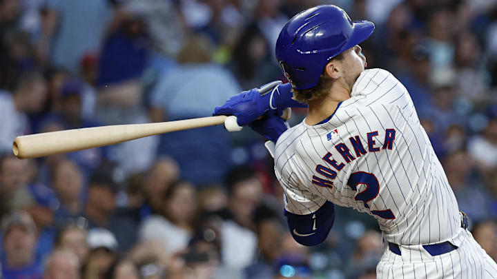 Sep 4, 2024; Chicago, Illinois, USA; Chicago Cubs second baseman Nico Hoerner (2) singles against the Pittsburgh Pirates during the second inning at Wrigley Field