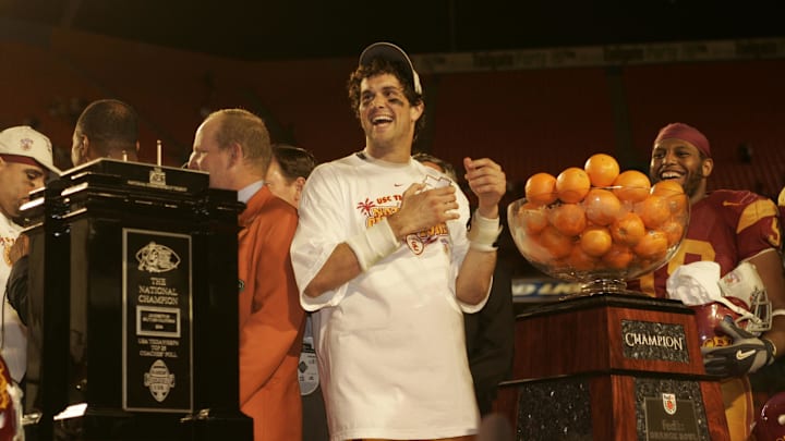 Jan 04, 2005; Miami, FL, USA; USC Trojans quarterback Matt Leinart jokes around during the trophy presentation after USC's 55-12 win over the Oklahoma Sooners in the 2005 Orange Bowl against the Oklahoma Sooners. Leinart, who threw 5 touchdowns, was named the game's MVP.
Mandatory Credit: Photo by Imagn Images (©) Copyright 2005 by Preston Mack