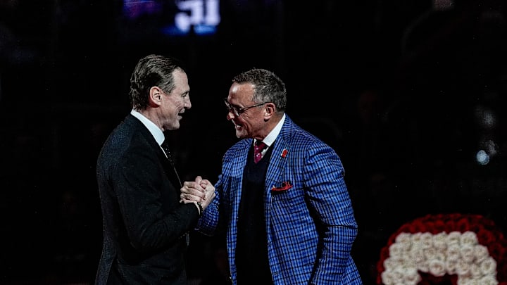Sergei Fedorov shakes hands with Steve Yzerman during his jersey retirement ceremony at Little Caesars Arena in Detroit on Monday, Jan. 12, 2026.