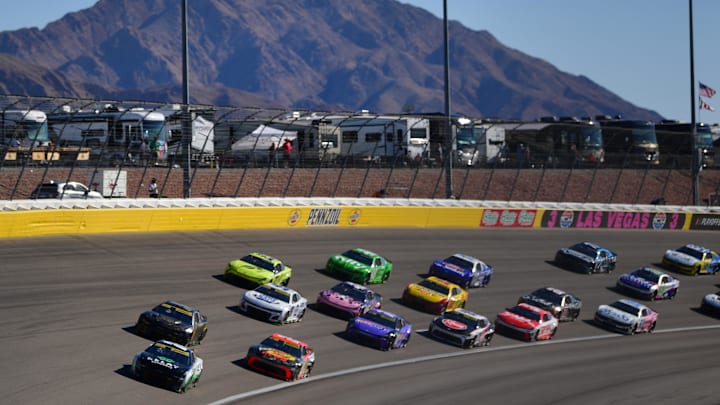 Oct 12, 2025; Las Vegas, Nevada, USA; NASCAR Cup Series driver William Byron (24) leads the field for the restart of the South Point 400 at Las Vegas Motor Speedway.