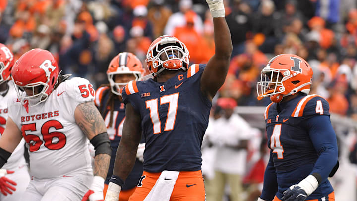 Nov 1, 2025; Champaign, Illinois, USA;  Illinois Fighting Illini linebacker Gabe Jacas (17) celebrates his sack on Rutgers Scarlet Knights quarterback Athan Kaliakmanis (16) during the first half at Memorial Stadium.