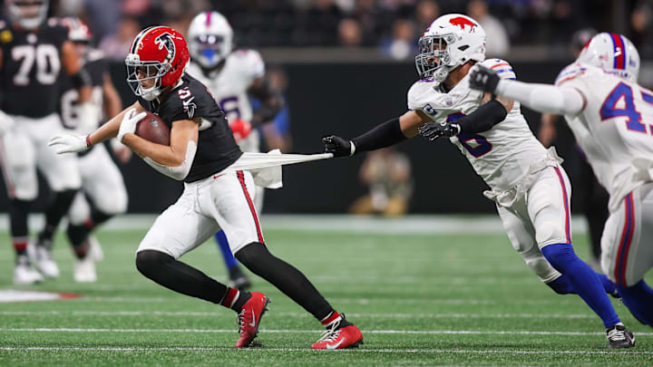 Oct 13, 2025; Atlanta, Georgia, USA; Buffalo Bills linebacker Terrel Bernard (8) attempts to drag down Atlanta Falcons wide receiver Drake London (5)