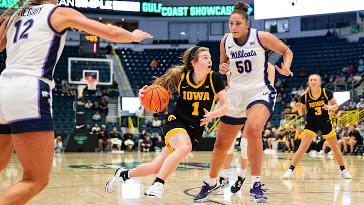 Iowa Hawkeyes guard Molly Davis (1) drives to the basket as Kansas State Wildcats center Ayoka Lee (50) gets ready to go up for the block.