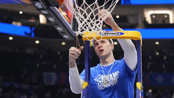Mar 15, 2025; Charlotte, NC, USA; Duke Blue Devils forward Cooper Flagg (2) cuts the net after winning the 2025 ACC Conference Championship game against the Louisville Cardinals at Spectrum Center. Mandatory Credit: Jim Dedmon-Imagn Images