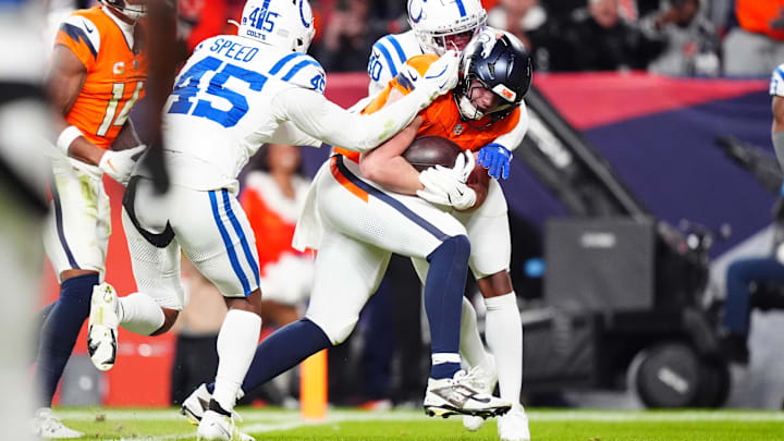 Dec 15, 2024; Denver, Colorado, USA; Denver Broncos tight end Nate Adkins (45) scores a touchdown past Indianapolis Colts linebacker E.J. Speed (45) and cornerback Jaylon Jones (40) in the second half at Empower Field at Mile High. Mandatory Credit: Ron Chenoy-Imagn Images Dec 15, 2024; Denver, Colorado, USA; Denver Broncos tight end Nate Adkins (45) scores a touchdown past Indianapolis Colts linebacker E.J. Speed (45) and cornerback Jaylon Jones (40) in the second half at Empower Field at Mile High. Mandatory Credit: Ron Chenoy-Imagn Images