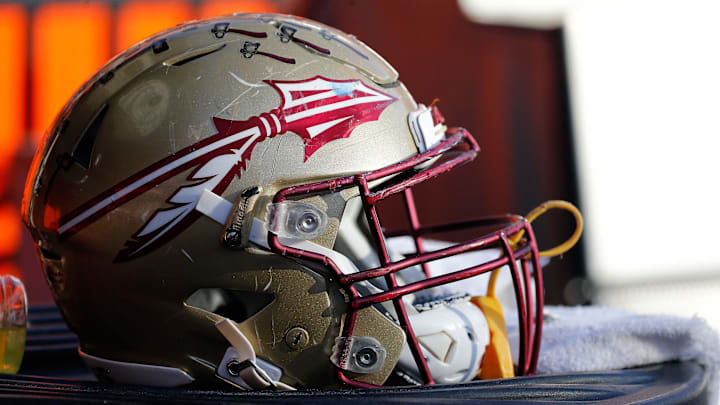 Nov 25, 2017; Gainesville, FL, USA; Florida State Seminoles helmet lays on the field against the Florida Gators during the second half at Ben Hill Griffin Stadium. Mandatory Credit: Kim Klement-Imagn Images Nov 25, 2017; Gainesville, FL, USA; Florida State Seminoles helmet lays on the field against the Florida Gators during the second half at Ben Hill Griffin Stadium. Mandatory Credit: Kim Klement-Imagn Images
