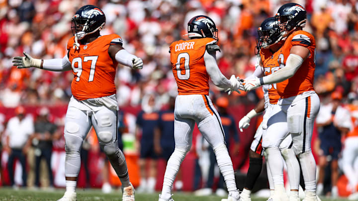 Sep 22, 2024; Tampa, Florida, USA; Denver Broncos linebacker Jonathon Cooper (0) celebrates after a sack against the Tampa Bay Buccaneers in the fourth quarter at Raymond James Stadium. 