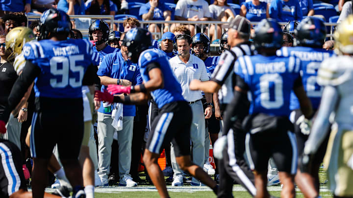 Oct 18, 2025; Durham, North Carolina, USA; Duke Blue Devils head coach Manny Diaz looks on during the first half of the game against Georgia Tech Yellow Jackets at Wallace Wade Stadium. Mandatory Credit: Jaylynn Nash-Imagn Images Oct 18, 2025; Durham, North Carolina, USA; Duke Blue Devils head coach Manny Diaz looks on during the first half of the game against Georgia Tech Yellow Jackets at Wallace Wade Stadium. Mandatory Credit: Jaylynn Nash-Imagn Images